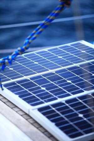 Solar charging batteries aboard a sail boat  Photovoltaic panels renewable eco energy conceptの写真素材