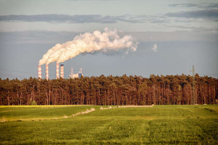Energy. Smoke from chimney of power plant or station. Industrial landscape.の写真素材