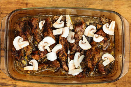 Food. Closeup of roasted chicken meat with champignons mushrooms dinner meal. Cooking and traditional cuisine.の写真素材