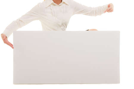 Advertisement. Female finger pointing at blank copy space banner isolated on white. Businesswoman recommending your productの写真素材