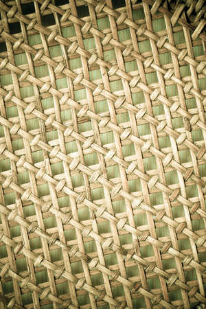Closeup of beige basket. Wicker woven pattern for abstract background or textureの写真素材