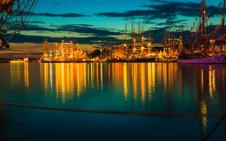 Sailing ships in the harbour during the tall ships races Bergen, Norway. Night viewの写真素材