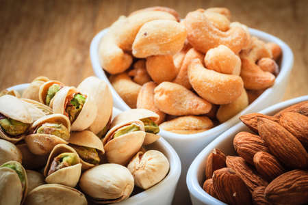 Healthy food and cuisine. Varieties of nuts: cashew, pistachio, almond