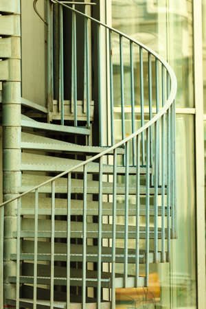 view of a spiral stair staircase, fire escape an office buildingの写真素材