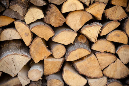 Heating. Closeup of firewood fire wood as background backdrop texture.