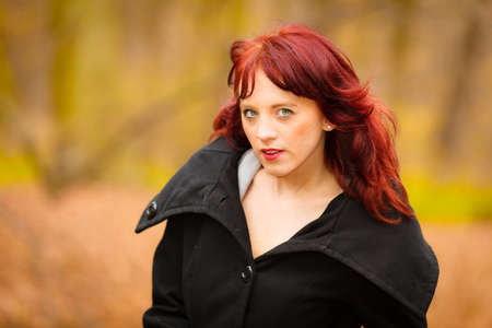 Fall lifestyle concept. fashion elegant young woman outdoor relaxing walking in autumn park