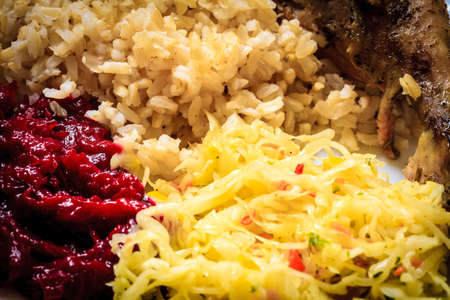 Food. Cooking and traditional cuisine. Chicken meat drumstick with rice and  vegetables saladの写真素材