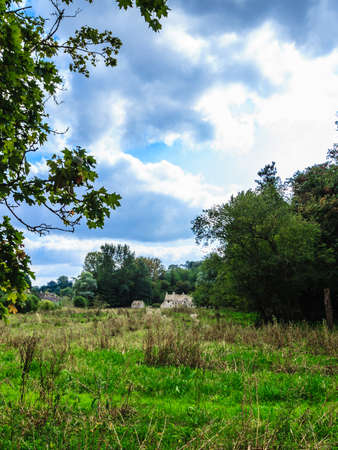 BIBURY, ENGLAND, UK - SEPTEMBER 21, 2014: Traditional Cotswold cottages in Gloucestershire on September 21, 2014, England. Bibury it the most depicted village in the world.のeditorial素材
