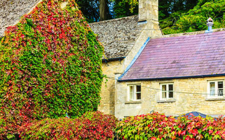 BIBURY, ENGLAND, UK - SEPTEMBER 21, 2014: Traditional Cotswold cottages in Gloucestershire on September 21, 2014, England. Bibury it the most depicted village in the world.のeditorial素材