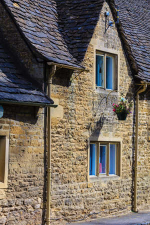 BIBURY, ENGLAND, UK - SEPTEMBER 21, 2014: Traditional Cotswold cottages in Gloucestershire on September 21, 2014, England. Bibury it the most depicted village in the world.のeditorial素材