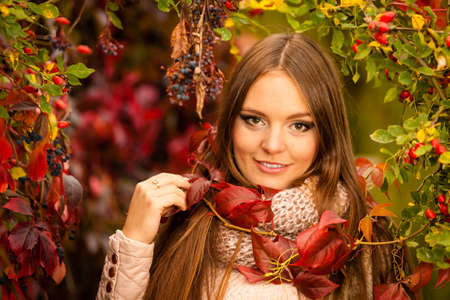 Fall lifestyle concept, harmony freedom. Beauty young woman fashion girl relaxing walking in autumnal park, outdoorの写真素材