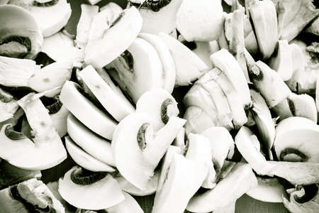 Vegetarian food. Closeup of slices of fresh white mushrooms champigonons.の写真素材