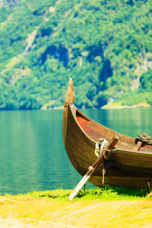 Tourism and travel. Mountains and fjord Sognefjord in Norway, Scandinavia. Old viking boat on...