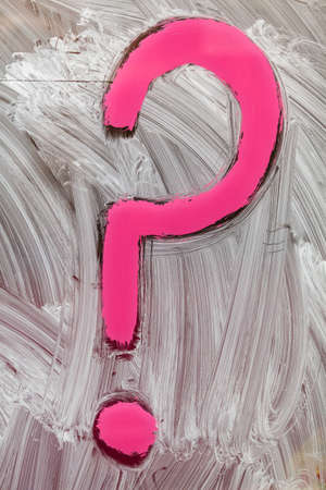hand painted pink question mark on white brushstroke background