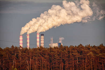 Energy. Smoke from chimney of power plant or station. Industrial landscape.の写真素材