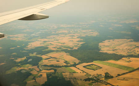 Birds eye. View from window of plane airplane flying over Poland Europe.