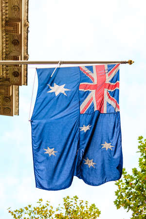 australian waving flag outdoor overcast day. Australia national symbol.の写真素材