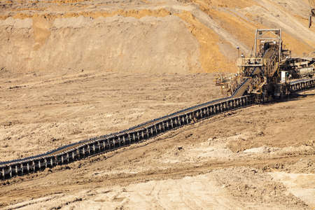 Open pit. Opencast brown coal mine. Belt conveyor as industrial detail.