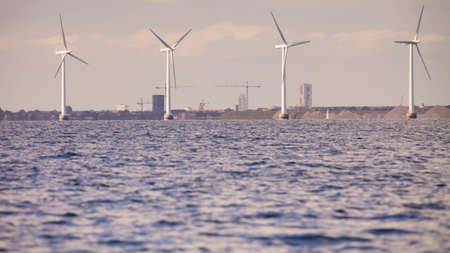 wind turbines power generator farm for renewable energy production along coast baltic sea near...