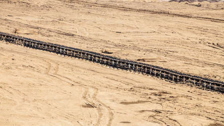 Open pit. Opencast brown coal mine. Belt conveyor as industrial detail.