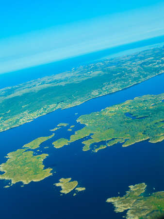 Birds eye. View from window of plane airplane flying over Norway Scandinavia.の写真素材
