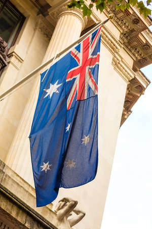 australian waving flag outdoor overcast day. Australia national symbol.の写真素材