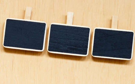 small blackboards slate chalk boards with space for text menu on wooden surface, empty blank signの写真素材