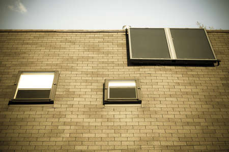 Renewable regenerative power and energy. Closeup of solar panel on troof of house. System of...