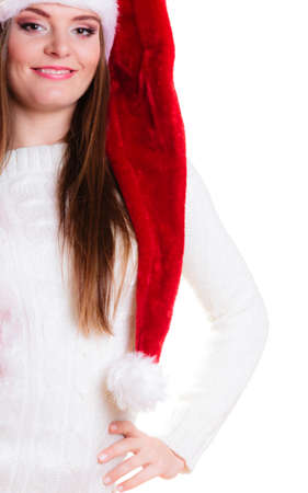Christmas winter happiness concept. Woman wearing santa helper hat portrait isolated on whiteの写真素材