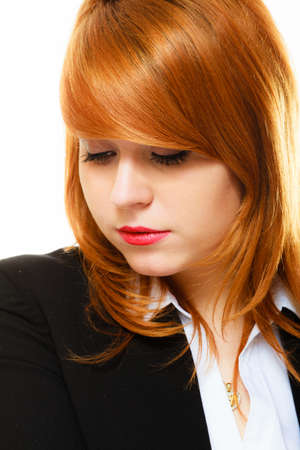 Portrait of beauty redhair thoughtful business woman or student girl looking down, isolated on white...