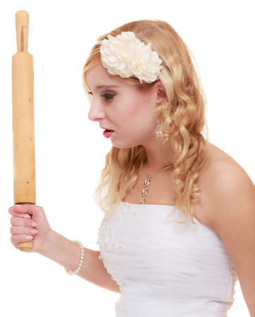 Argument conflict, bad relationships. Angry woman fury bride holds rolling pin in fight with somebody. Isolatedの写真素材