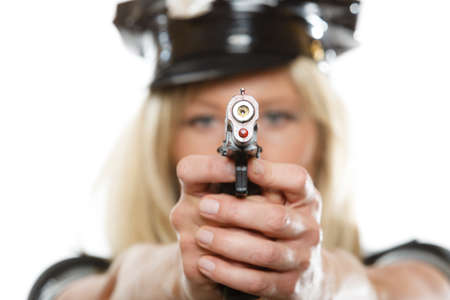 blonde female policewoman cop posing with gun handgun isolated on white backgroundの写真素材