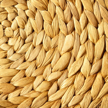 Closeup of beige basket. Wicker woven pattern for abstract background or texture. Square format.の写真素材