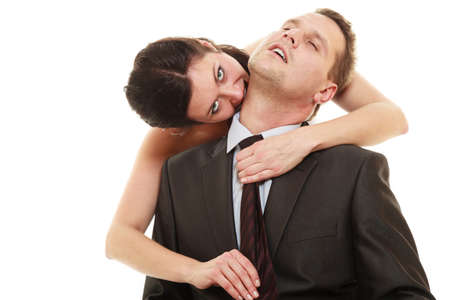 Emancipation. Woman pulling tie of man, wife showing her domination over husband isolated on white.の写真素材