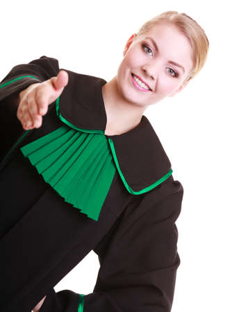 Law court or justice concept. Womn lawyer attorney wearing classic polish (Poland) black green gown welcome invitating hand sign gesture or giving palm for handshake isolated on whiteの写真素材