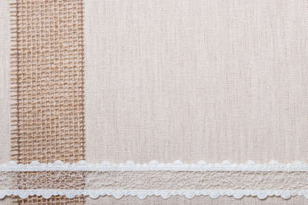 Lace frame on natural linen, bright cloth fabric background. Retro styleの写真素材