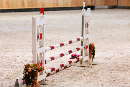 Equitation. Obstacle for jumping horses. Riding competition.の写真素材