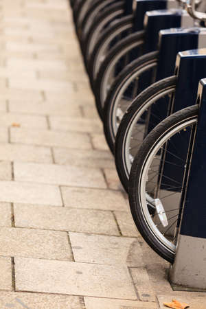 Rent a bike. Lots of parked bicycles on the city street, London Englandの写真素材