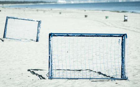 Summer vacation, active lifestyle concept. Football gate on sandy beach soccer goalの写真素材