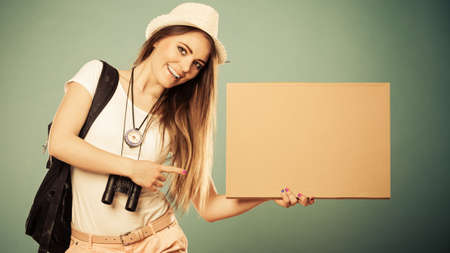 Summer tourism active lifestyle concept. Woman happy female tourist hitchhiking with blank sign...