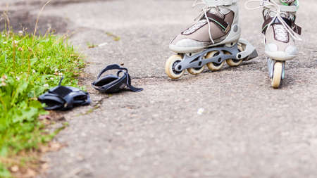 Enjoying roller skating rollerblading on inline skates sport in park. Outdoor activities.