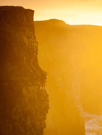 Famous cliffs of Moher at sunset in Co. Clare Ireland Europe. Beautiful landscape natural attraction.の写真素材