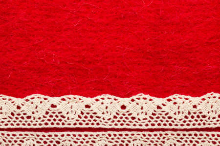 Retro border for invitations celebration. Vintage white lace over red textile .の写真素材