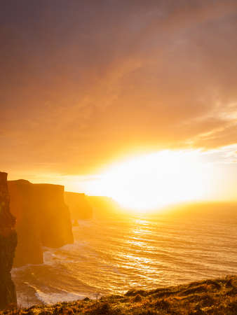 Famous cliffs of Moher at sunset in Co. Clare Ireland Europe. Beautiful landscape natural attraction.の写真素材