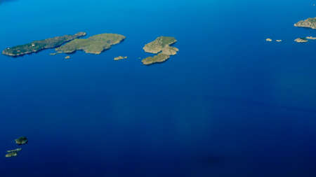 Birds eye. View from window of plane airplane flying over fjords Norway Scandinavia.の写真素材