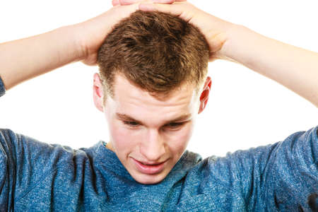 Negative human emotions, facial expressions, reaction attitude. Closeup stressed man holding head...