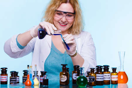 Experiment, research in progress. Chemist woman or student girl, laboratory assistant or scientific...