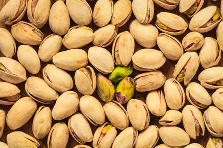 Diet healthcare concept. Food background. Roasted pistachio nuts seed with shell close up.の写真素材