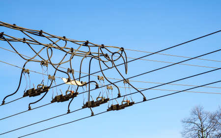 Trolley overhead line wire switch. Electrical cable. Electricity used in ecological transportation.の写真素材