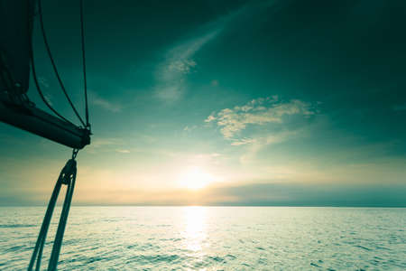 Yachting yacht sailboat sailing in baltic sea at sunset sunrise summer vacation. Tourism luxury lifestyle.の写真素材